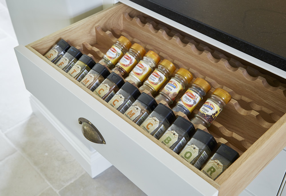 A spice rack built in to a kitchen drawer