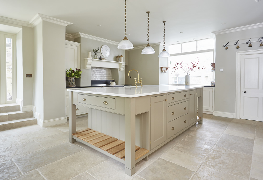 A very light and spacious kitchen with stone floor and aga oven