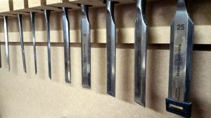 An array of wood working chisels