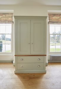 Kitchen pantry from barnes of Ashburton with satin chrome handles and lime paint from Farrow and Ball